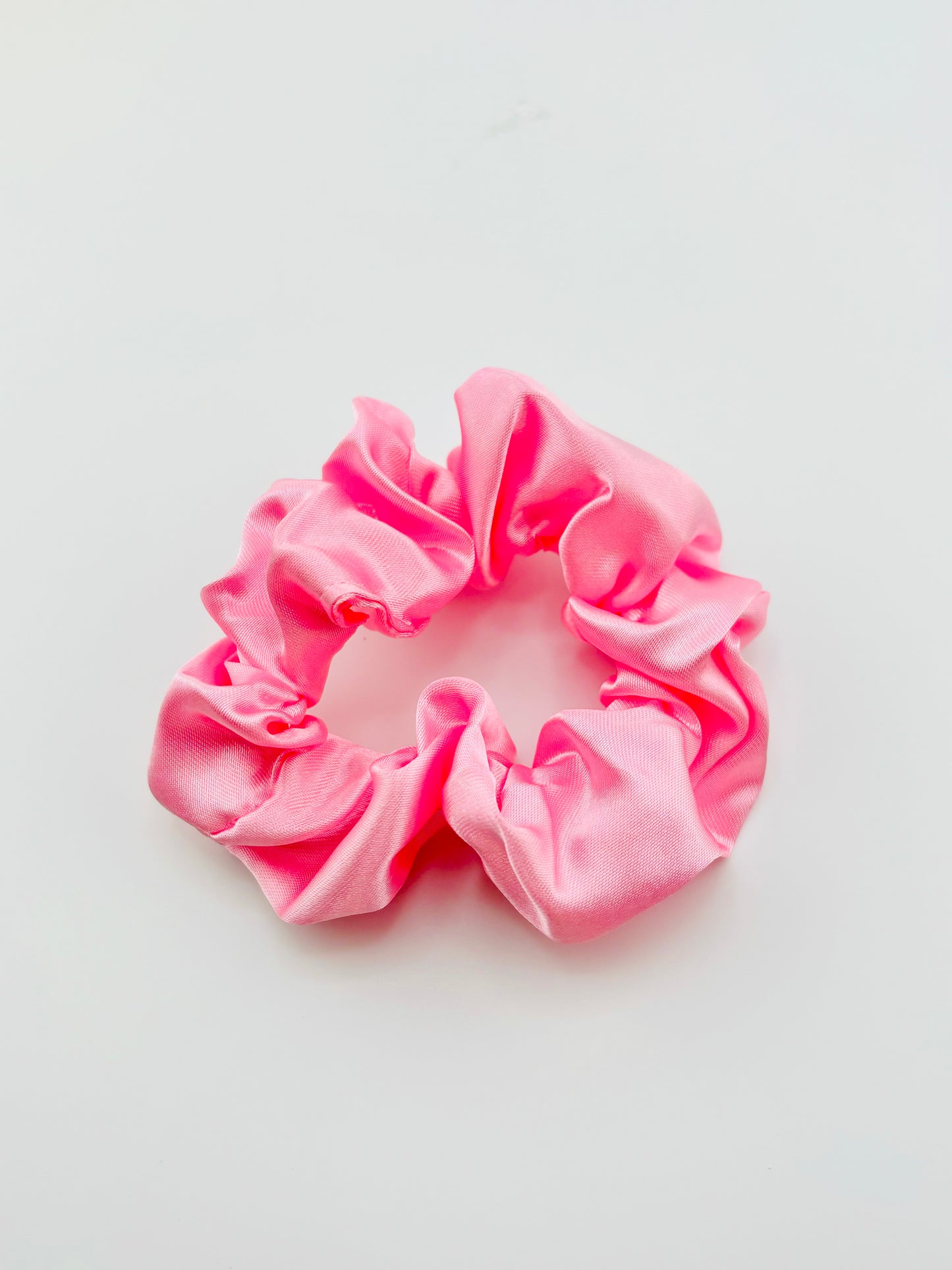 Pink scrunchie in charmeuse