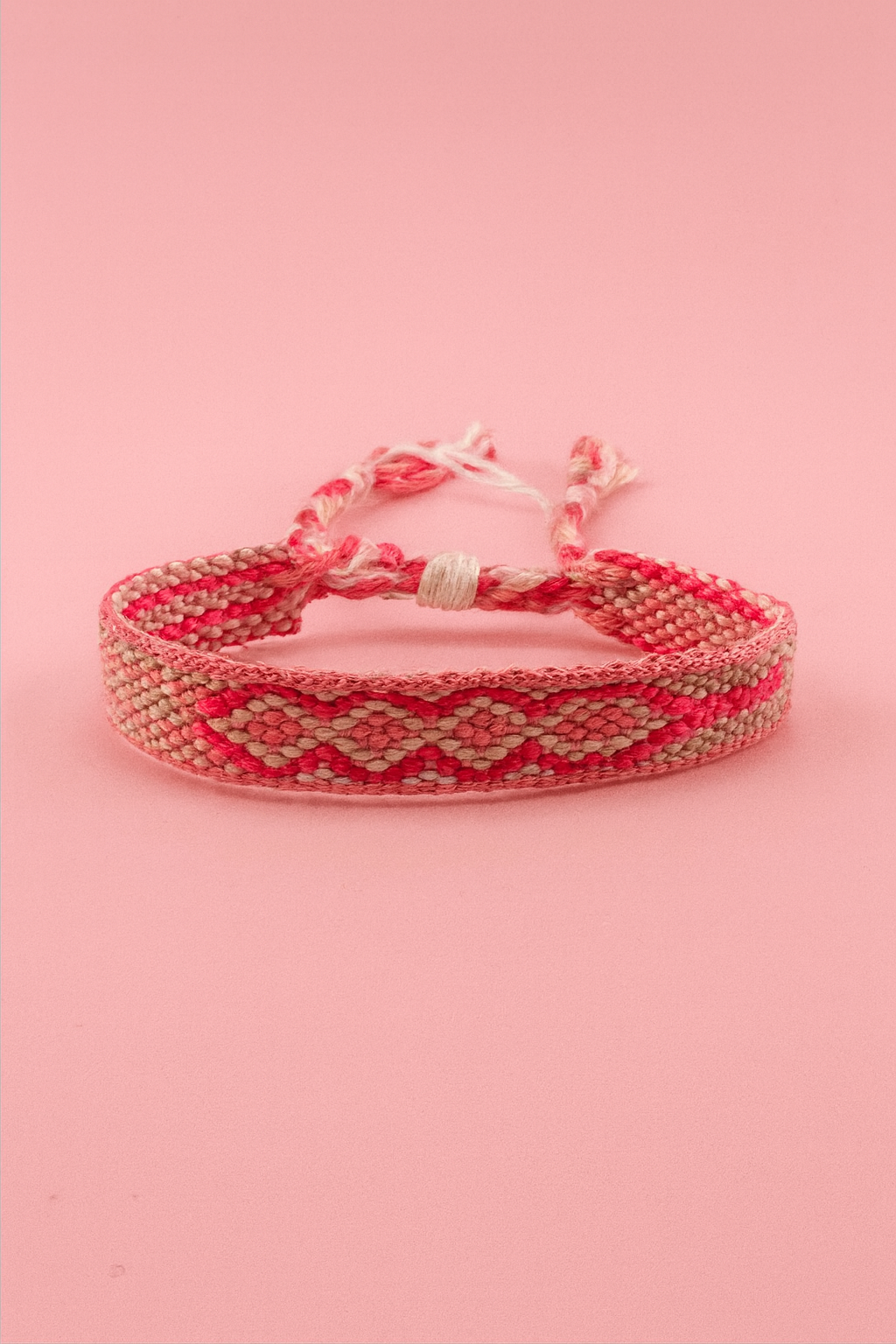 Bassie pink and white adjustable woven bracelet
