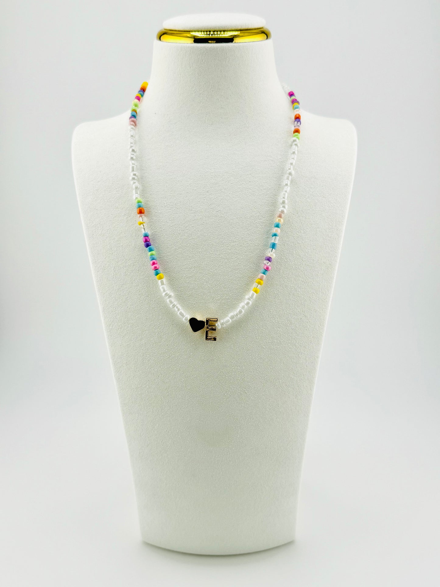 E beaded Initial necklace in white and pastel colors