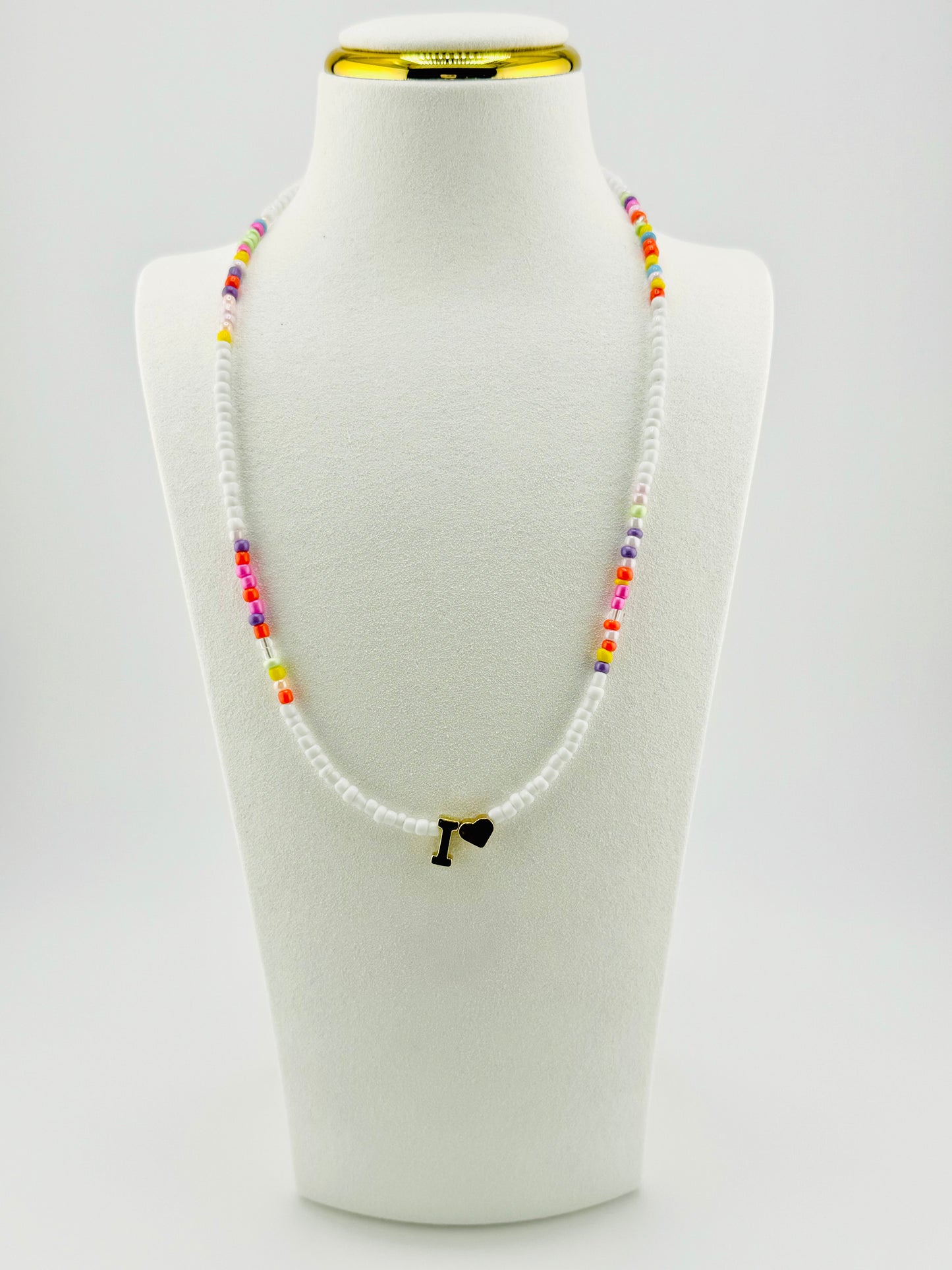 I beaded Initial necklace in white and pastel colors