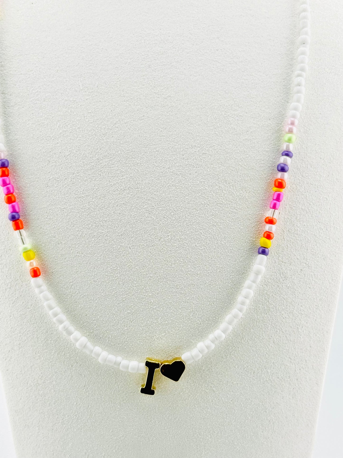 I beaded Initial necklace in white and pastel colors