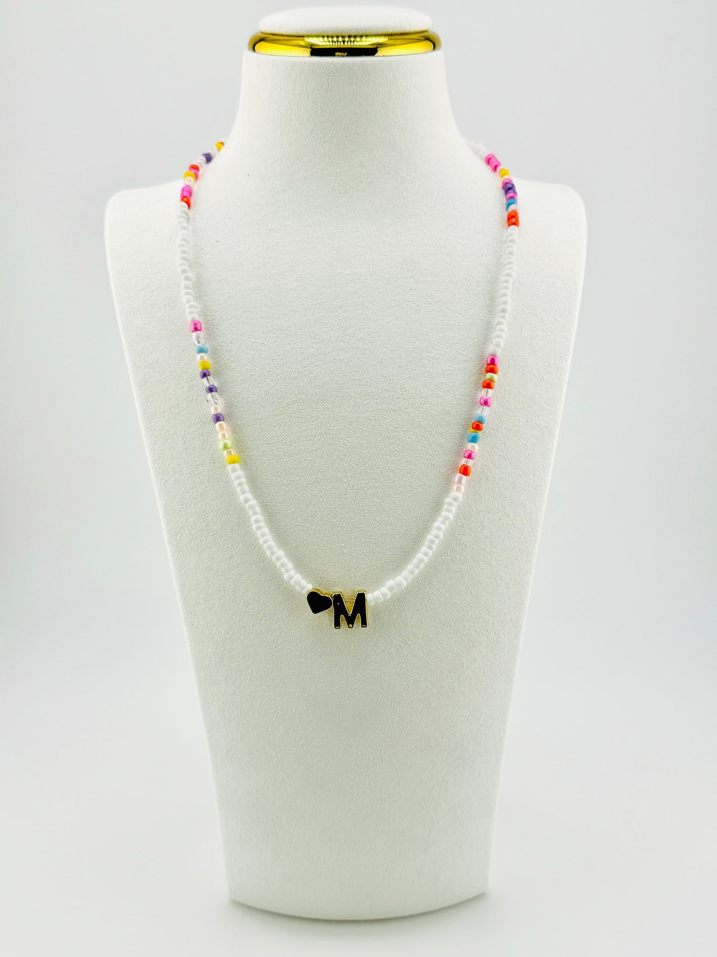 M beaded Initial necklace in white and pastel colors
