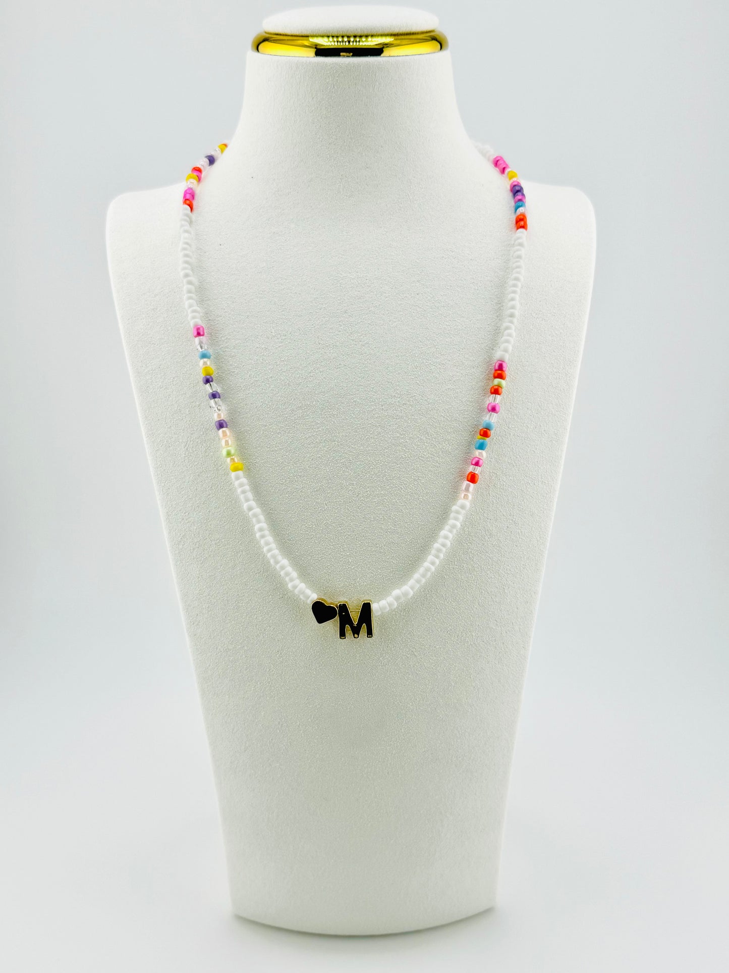 M beaded Initial necklace in white and pastel colors