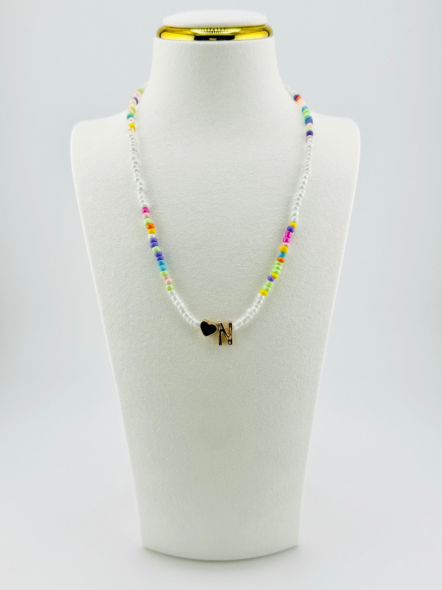 N beaded Initial necklace in white and pastel colors