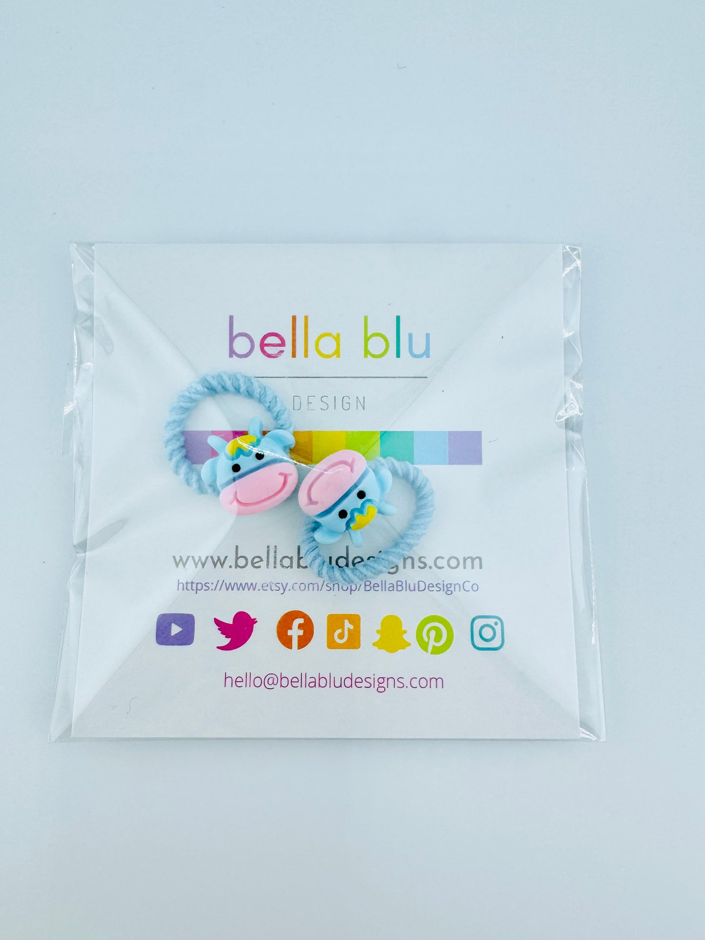 light blue and pink cow hair ties set