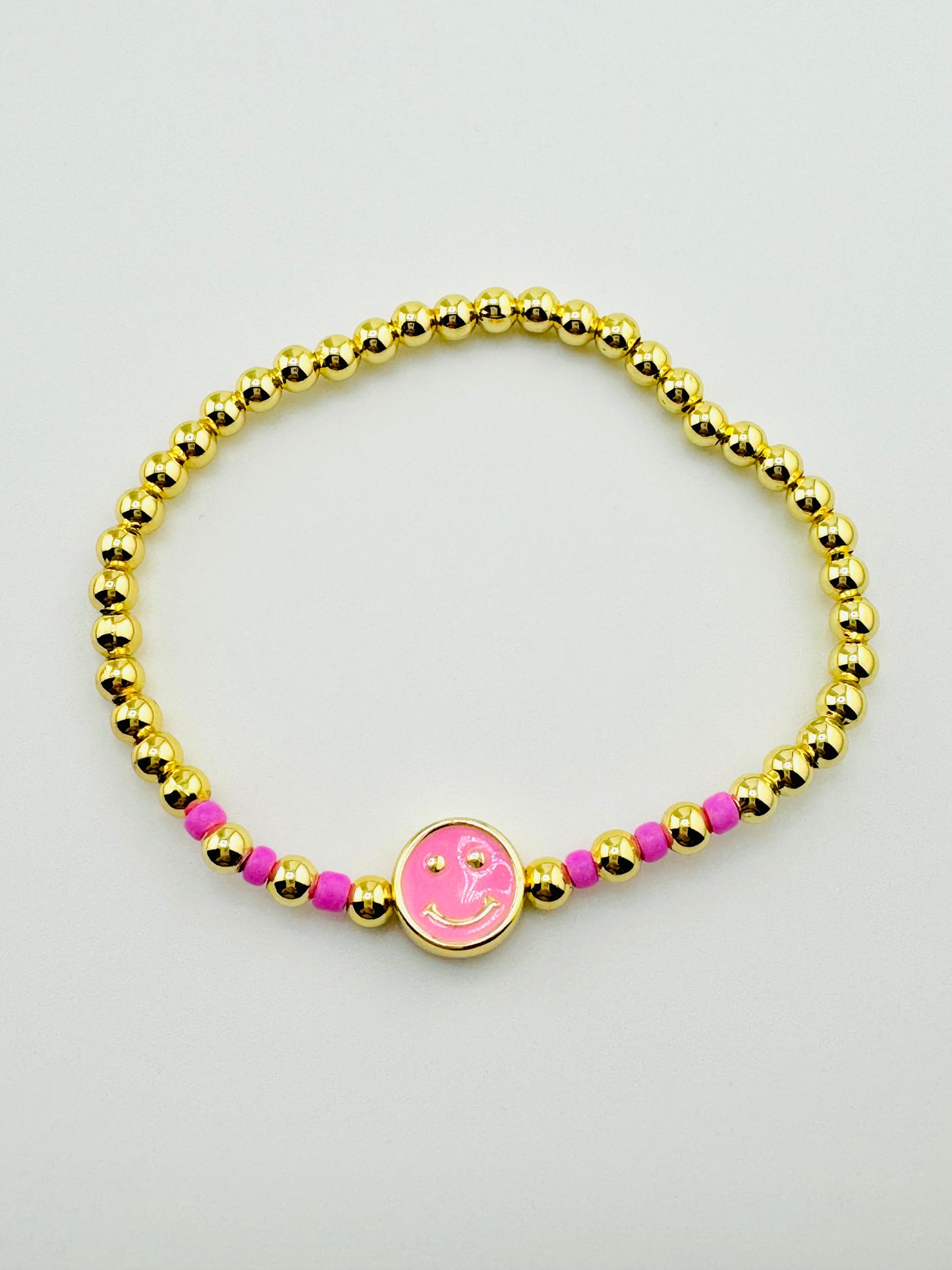 Delilah pink happy face in 18k gold filled bracelet