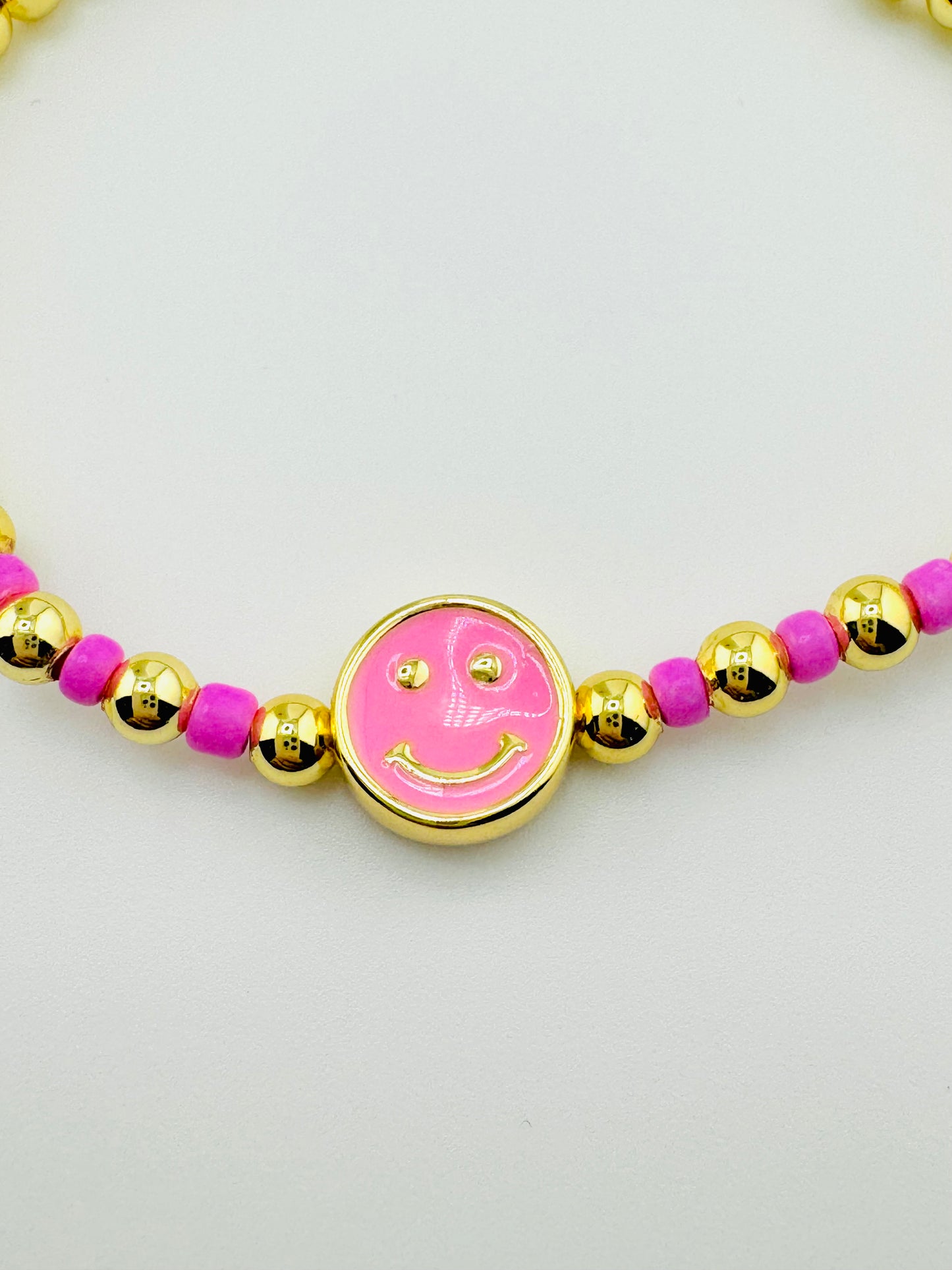 Delilah pink happy face in 18k gold filled bracelet
