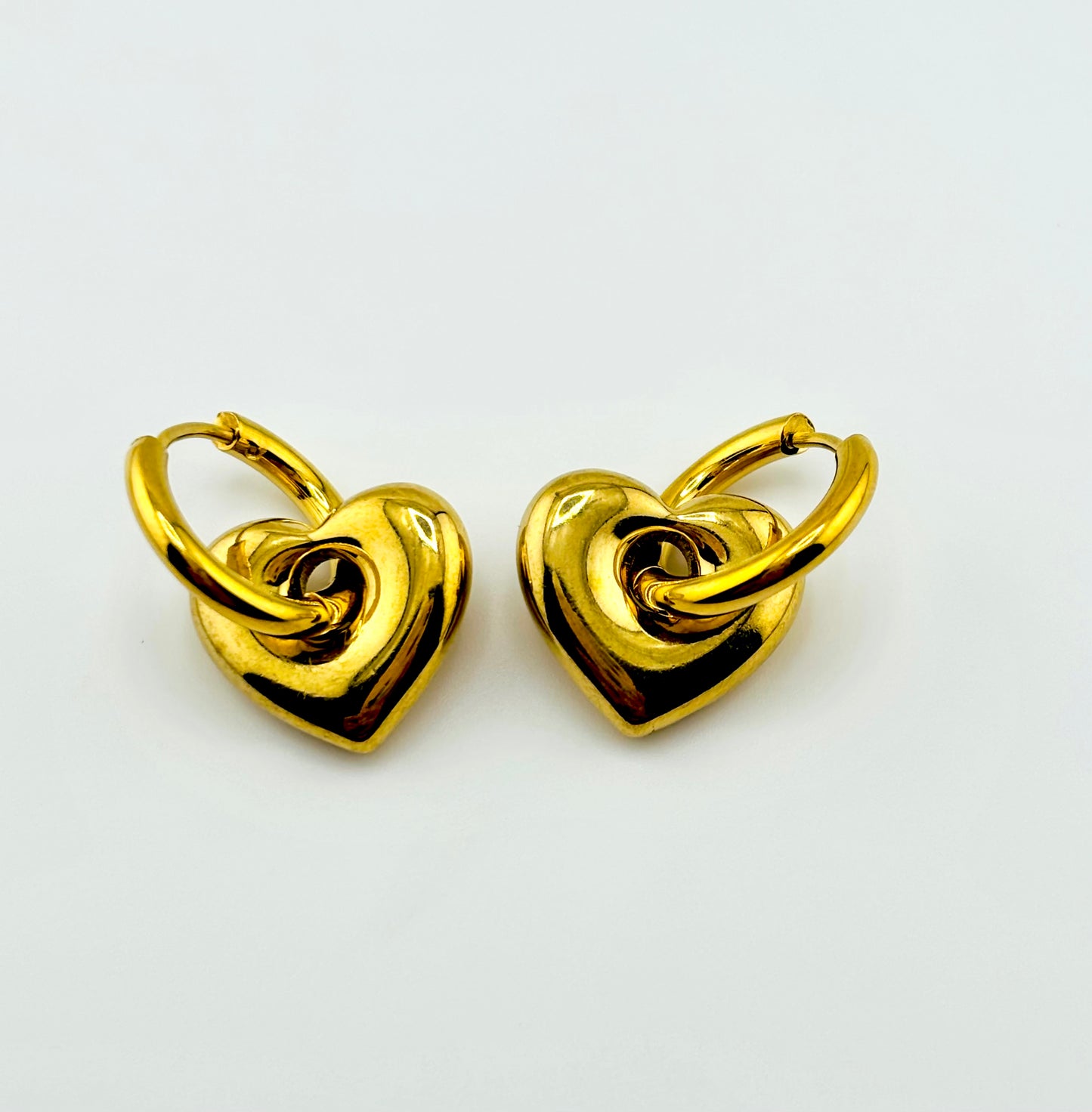 Radiate love gold hopes in hearts in stainless steel