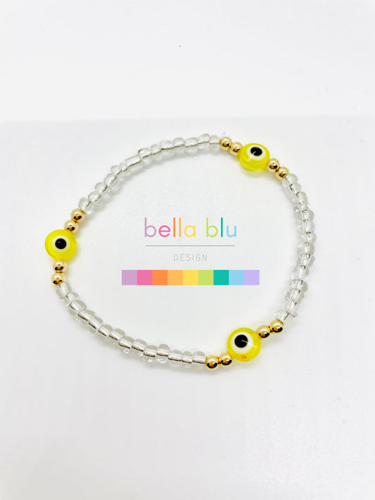 transparent and yellow evil eye bracelet