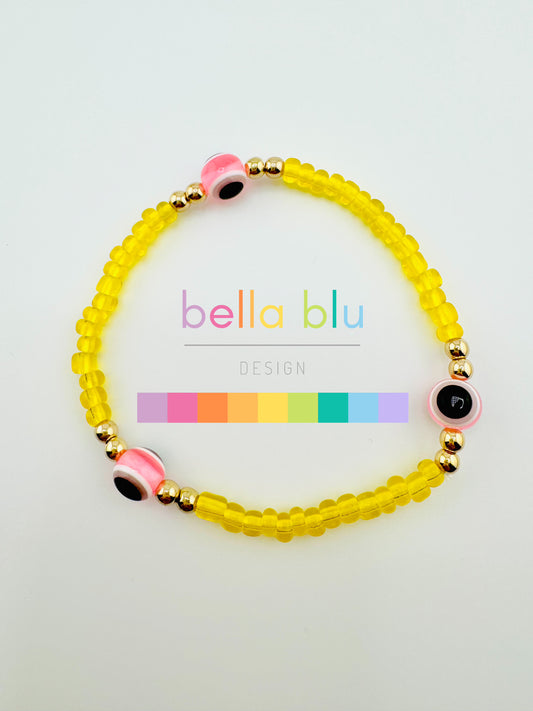 Yellow and light pink evil eye bracelet
