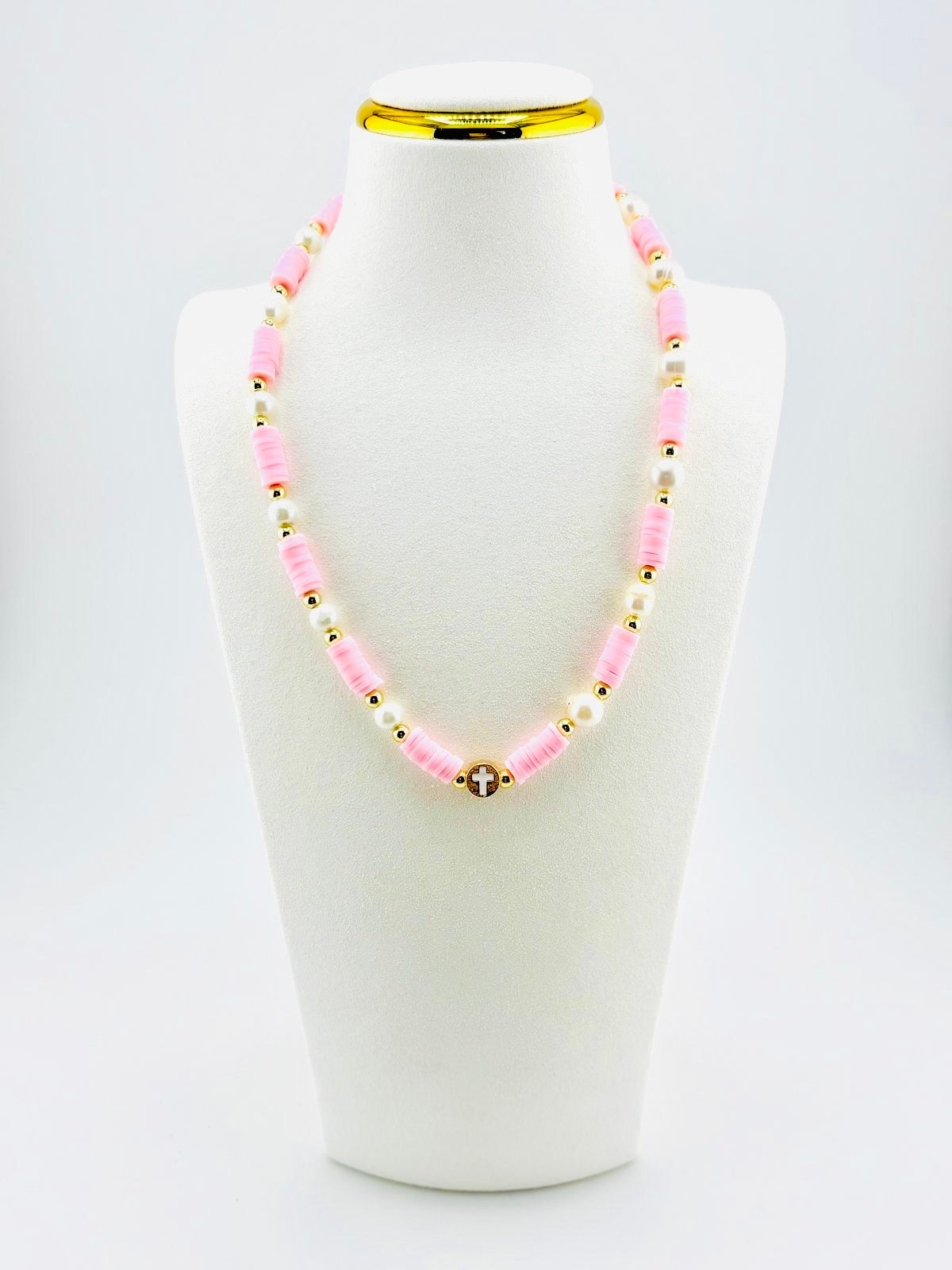 The cross beautifully made real fresh water pearls in soft pink and 18k gold filled
