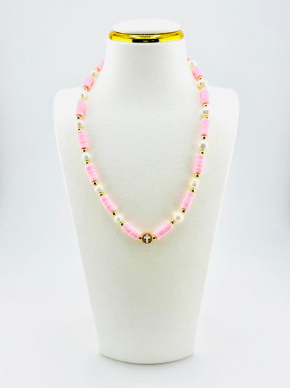 The cross beautifully made real fresh water pearls in soft pink and 18k gold filled