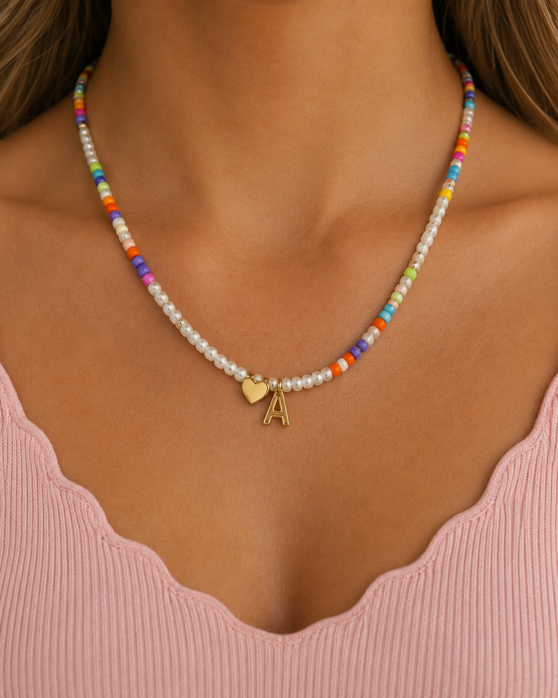 A beaded Initial necklace in white and pastel colors