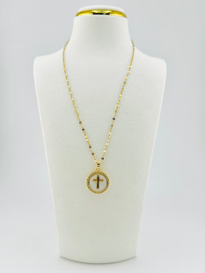 Front view of 18K gold-filled mother of pearl cross necklace on white display