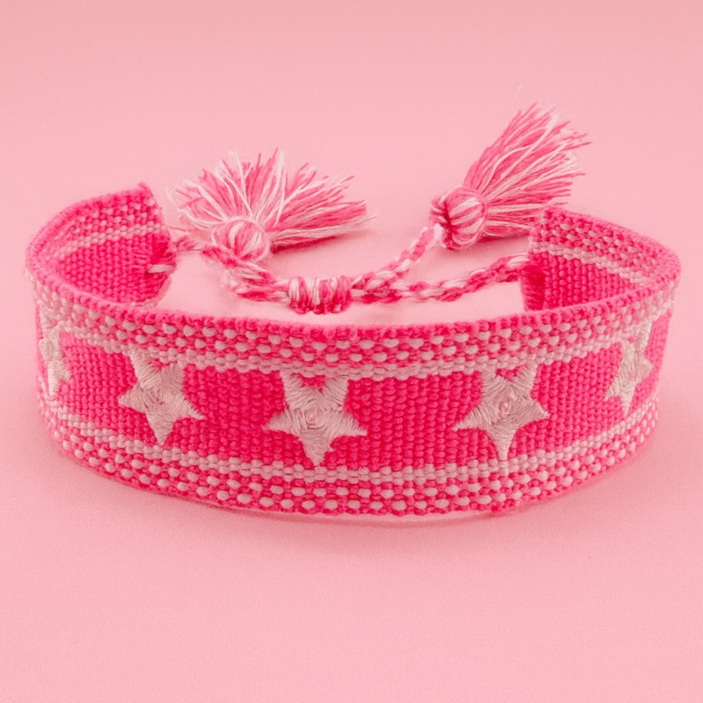 Pink woven bracelet with white stars