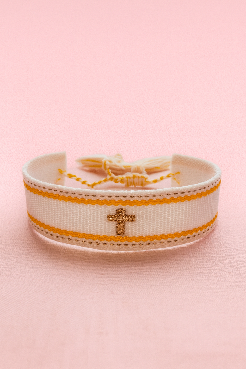 Cross white, orange, & gold adjustable woven bracelet
