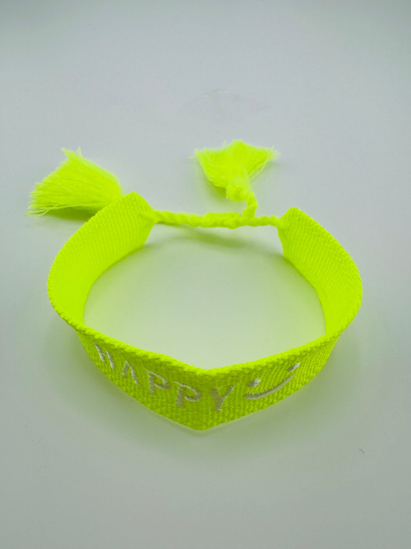 Loren yellow neon woven bracelet in smiley face