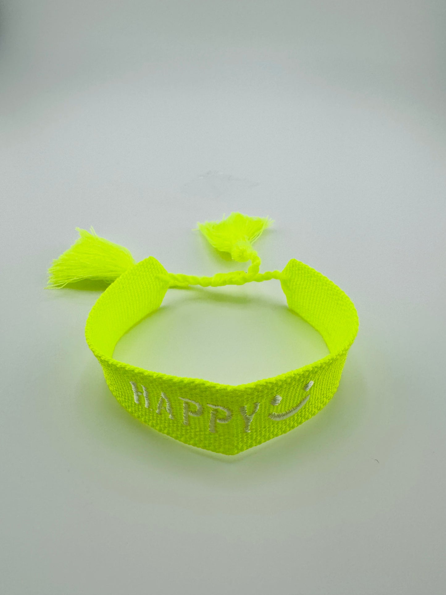 Loren yellow neon woven bracelet in smiley face