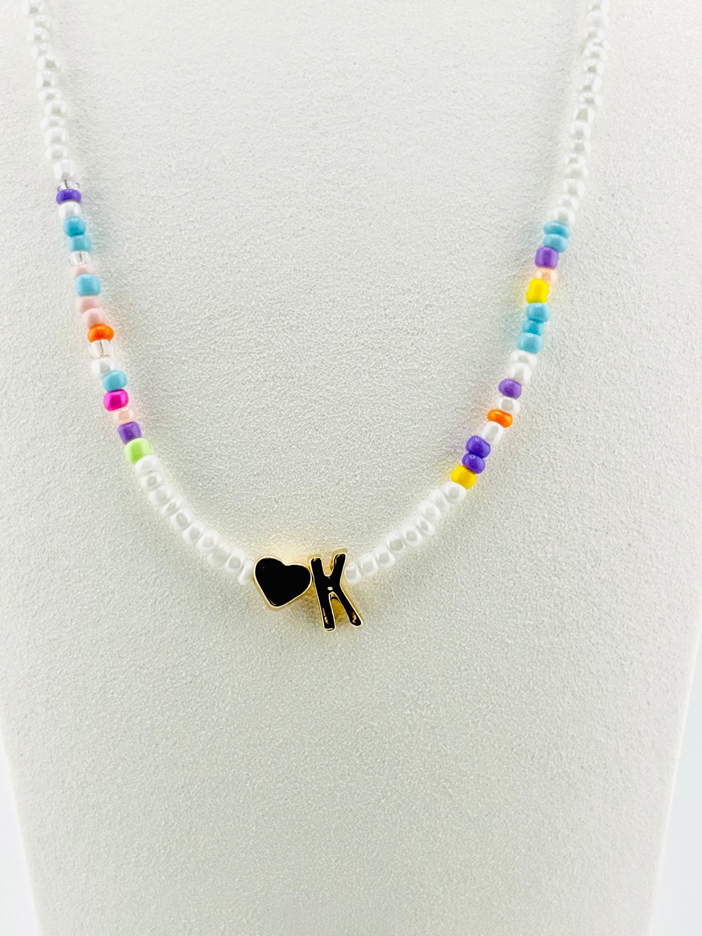 K beaded Initial necklace in white and pastel colors