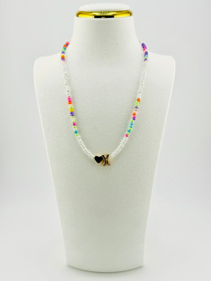 X beaded Initial necklace in white and pastel colors