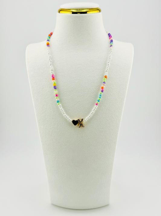 X beaded Initial necklace in white and pastel colors