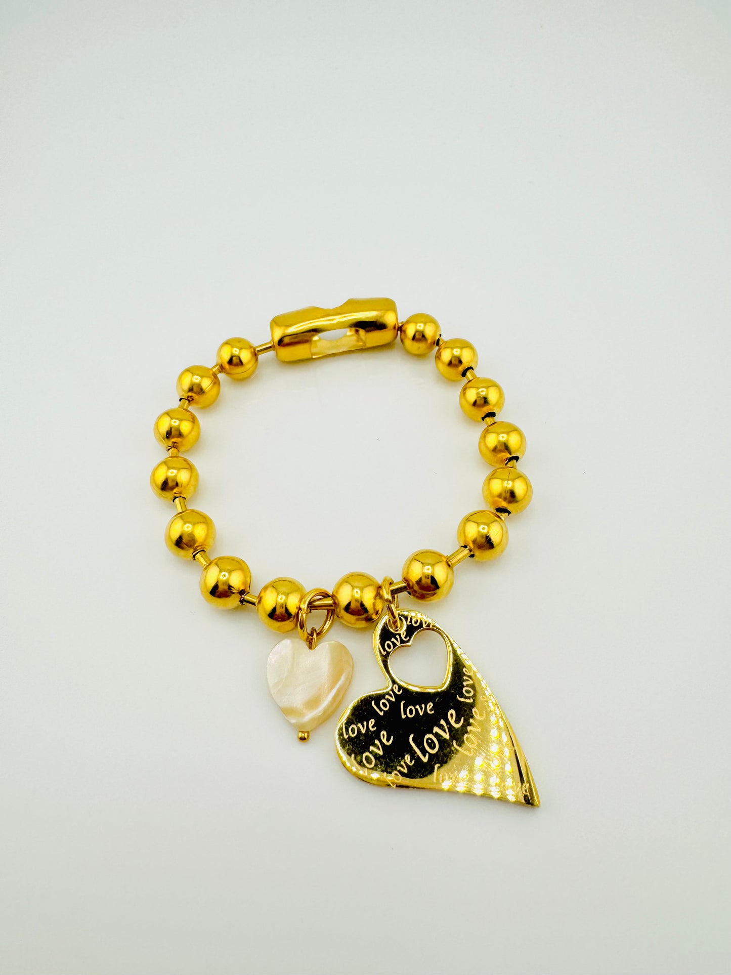 Celine stainless steel bracelet with a heart charm