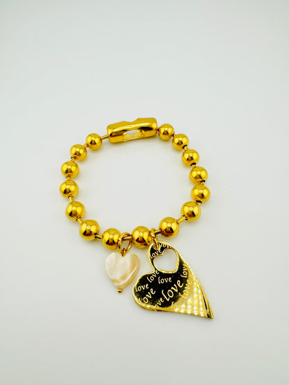 Celine stainless steel bracelet with a heart charm