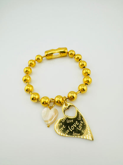 Celine stainless steel bracelet with a heart charm