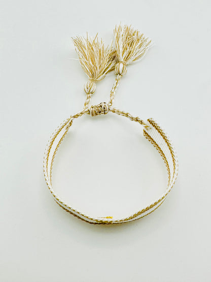 Cross woven bracelet in gold and white thread