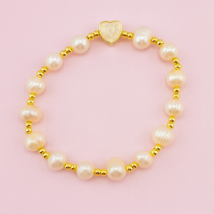 Jennifer freshwater pearl heart bracelet with gold-filled beads on pink background