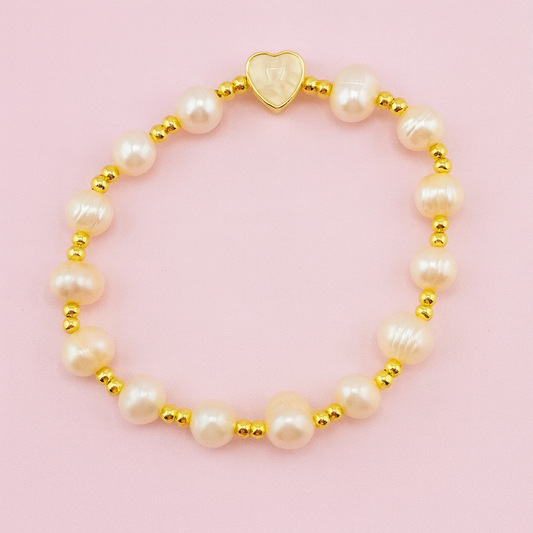 Jennifer freshwater pearl heart bracelet with gold-filled beads on pink background