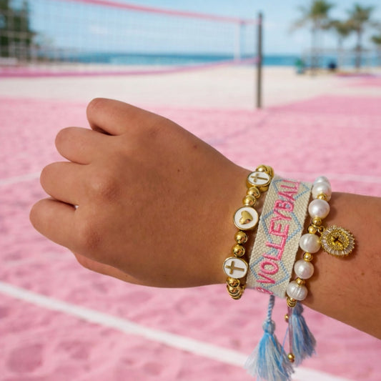 Volleyball woven bracelet in blue band with pink letters