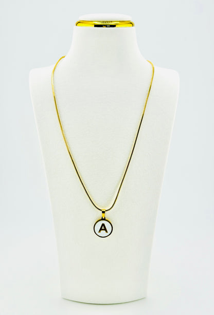 Round mother-of-pearl letter A pendant necklace with polished gold-tone chain