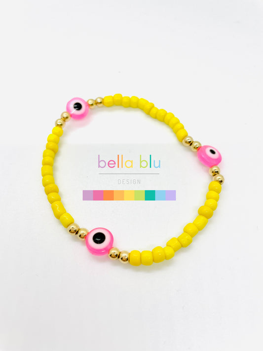 yellow and pink evil eye bracelet