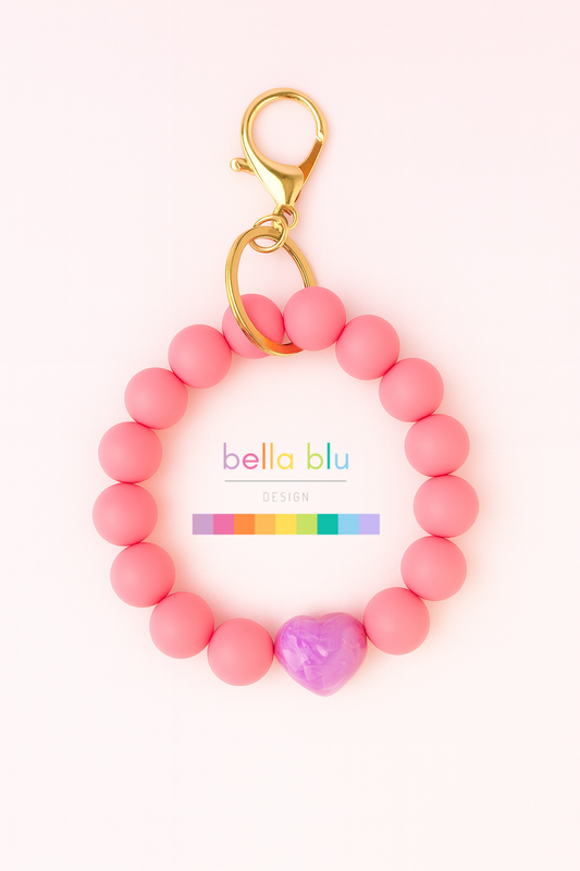 bubblegum pink wristlet keychain with a coquette bow heart