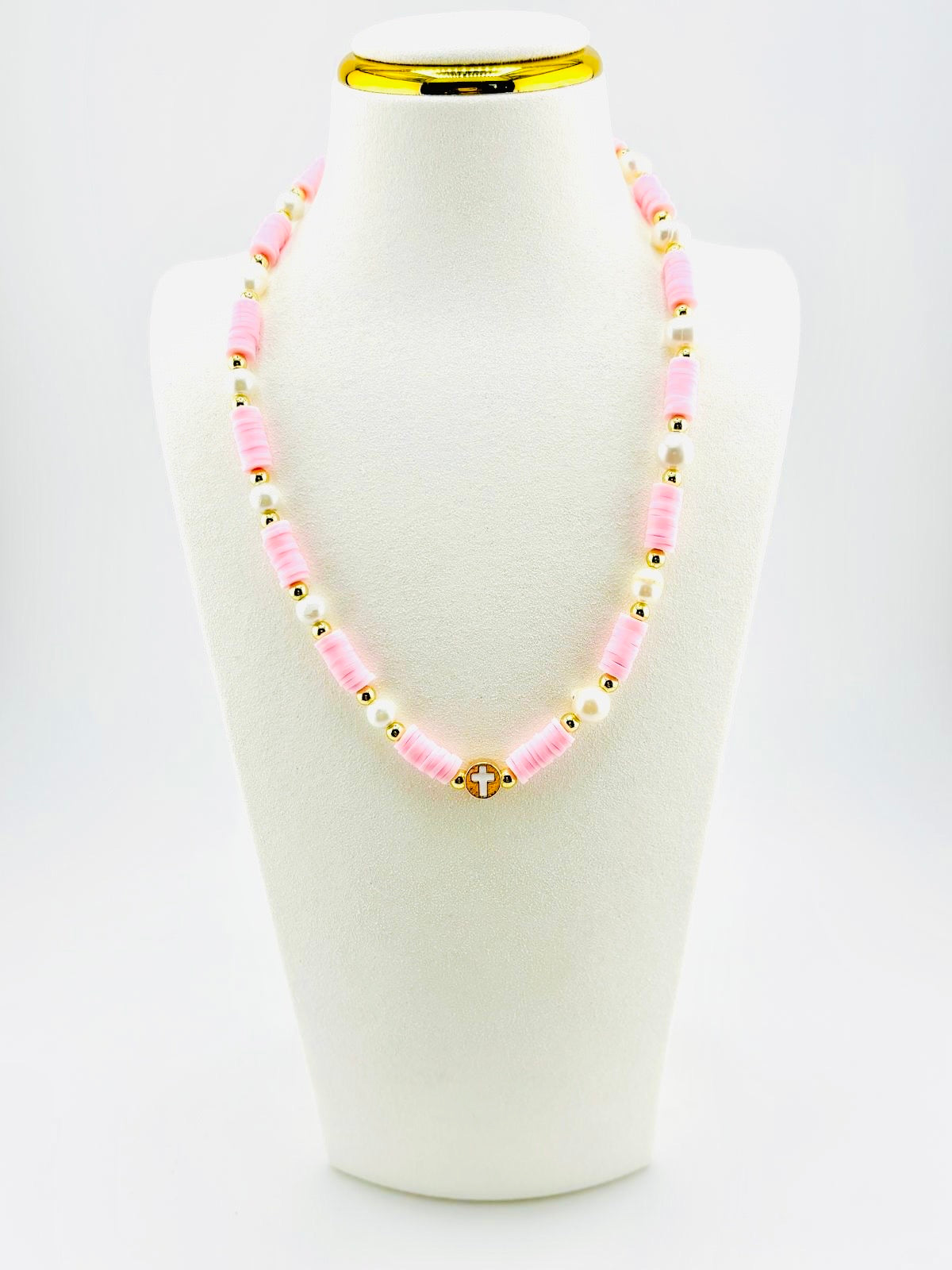 The cross beautifully made real fresh water pearls in soft pink and 18k gold filled