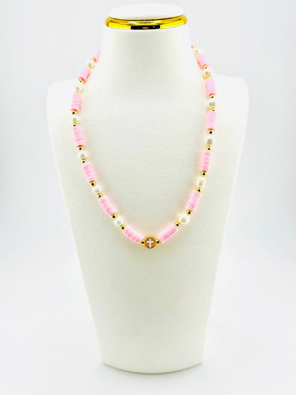 The cross beautifully made real fresh water pearls in soft pink and 18k gold filled