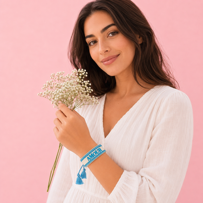 Woman wearing Amour blue and beige adjustable woven bracelet